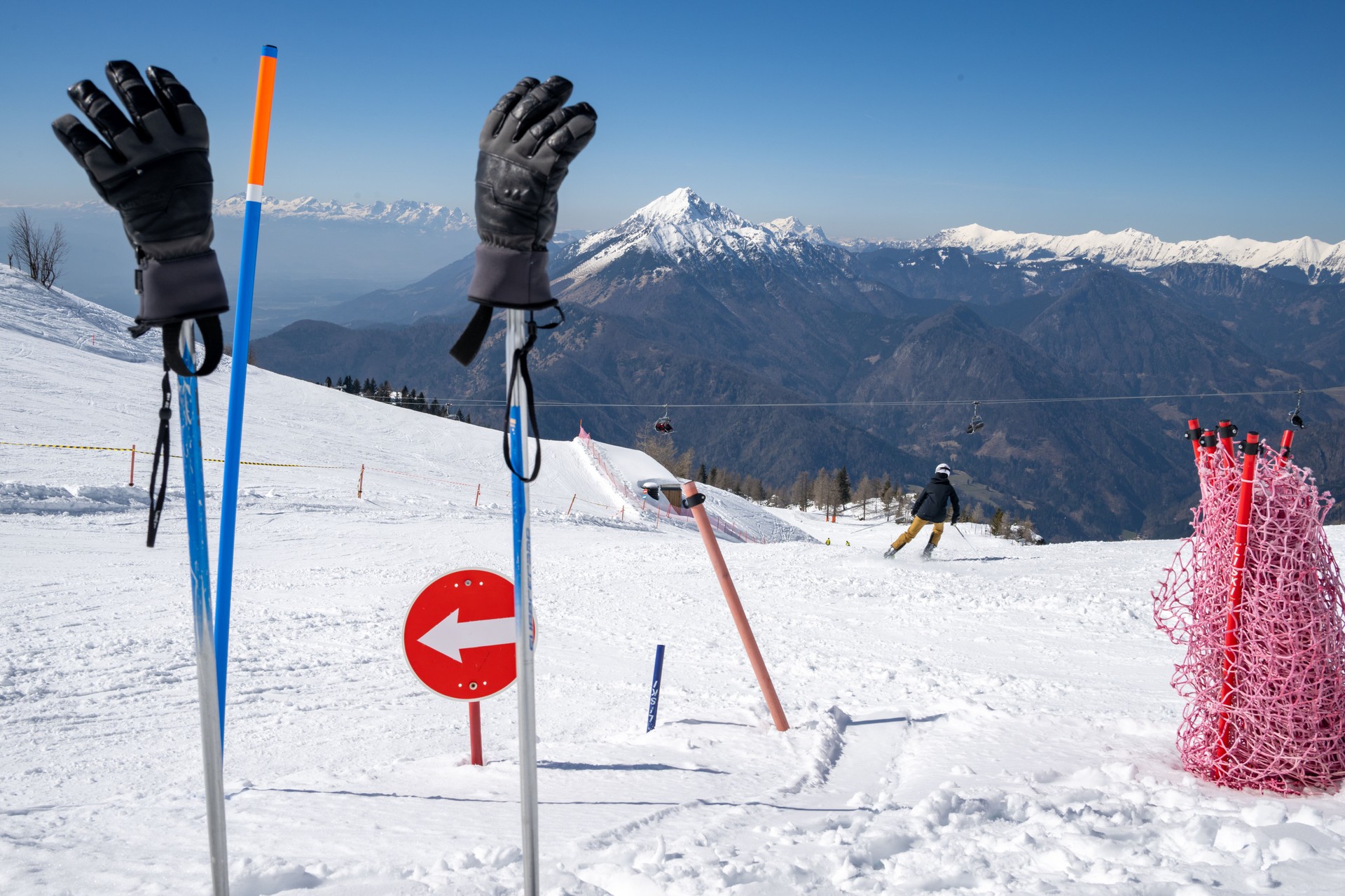 Snowy Mountain Slope with Skier and Gloves