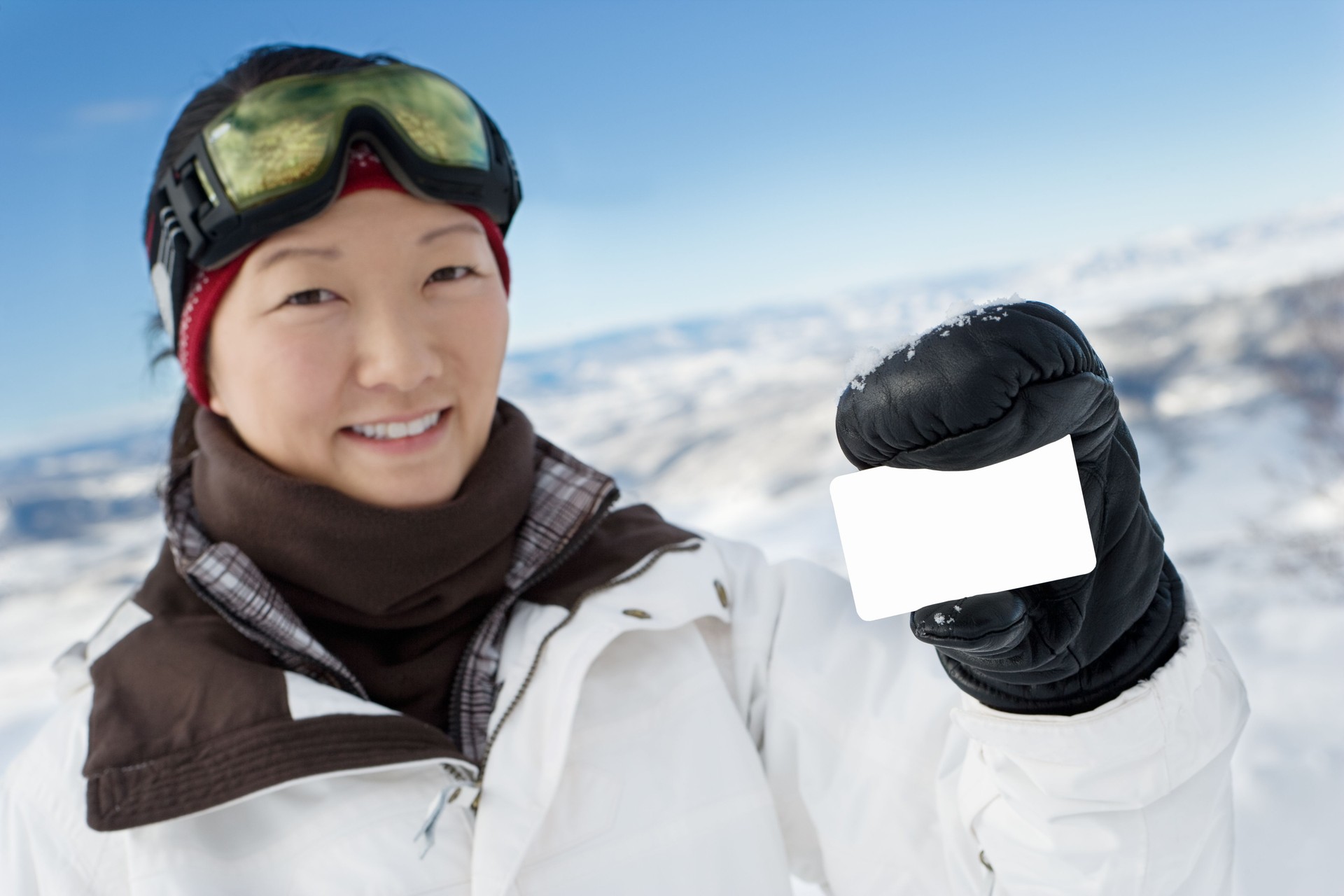 skier holding small card