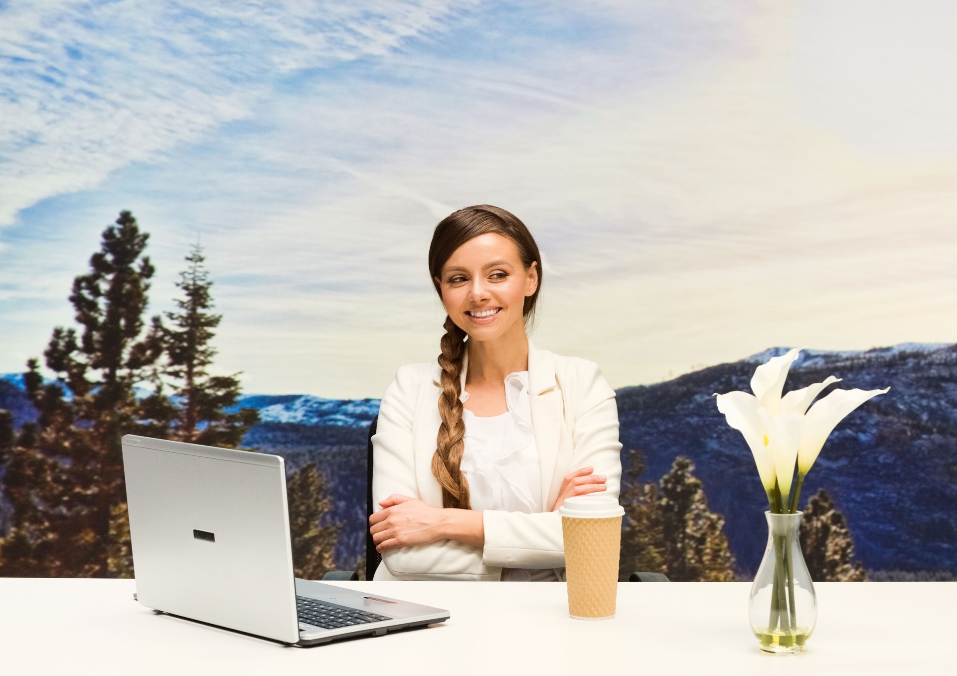 Cheerful businesswoman sitting outdoors