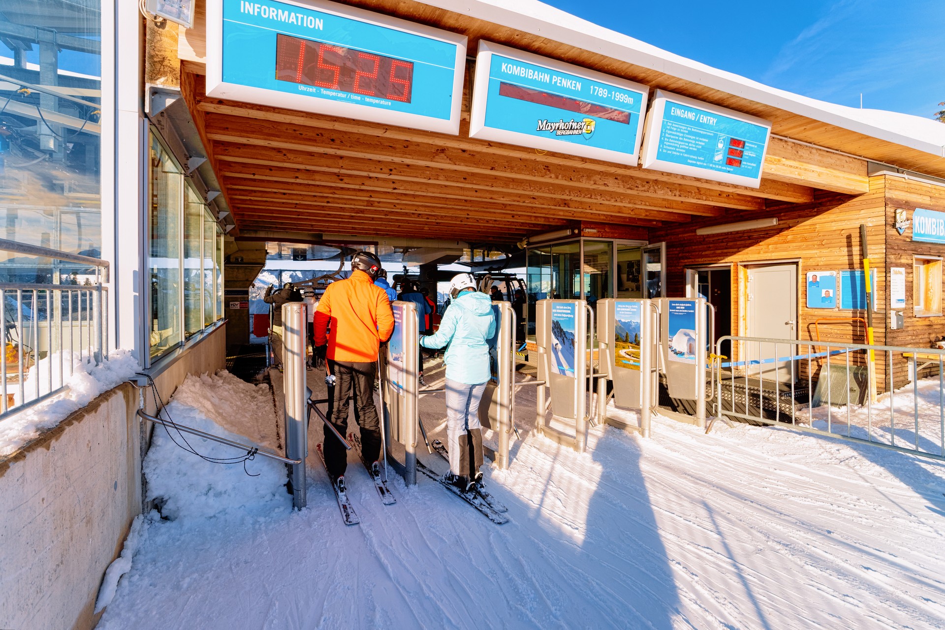 People on ski ticket gate in Penkenbahn Station Austria